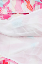 Brushstroke print midi dress in blush pink with smocked bodice detail and balloon sleeves.