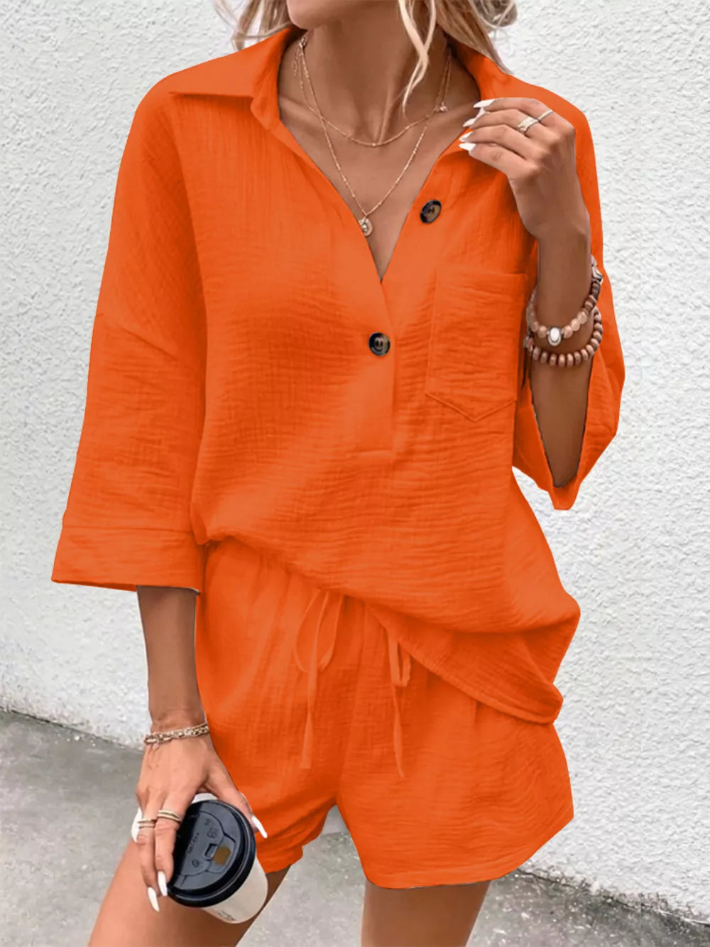 Orange-red cotton two-piece set with buttoned collared shirt and drawstring shorts