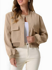 Tan utility pocket bomber jacket with ribbed cuffs and collar, button front, and casual chic style.