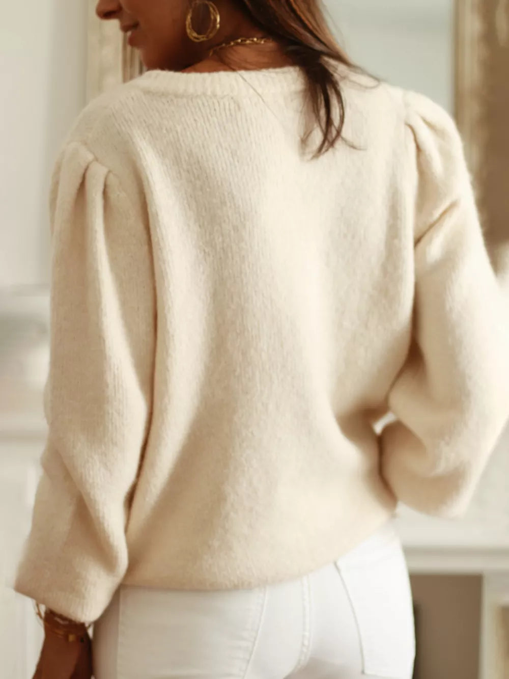 Cream knit cardigan with puff sleeves and open knit panels, acrylic.