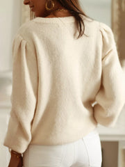 Cream knit cardigan with puff sleeves and open knit panels, acrylic.