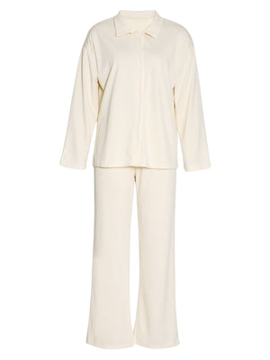 Cream ribbed knit loungewear set with button-up shirt and wide-leg pants.