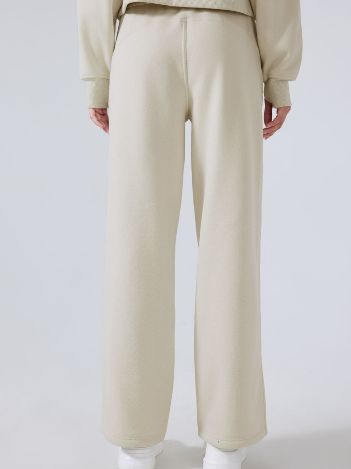 Beige relaxed fit palazzo sweatpants with drawstring waist and wide leg