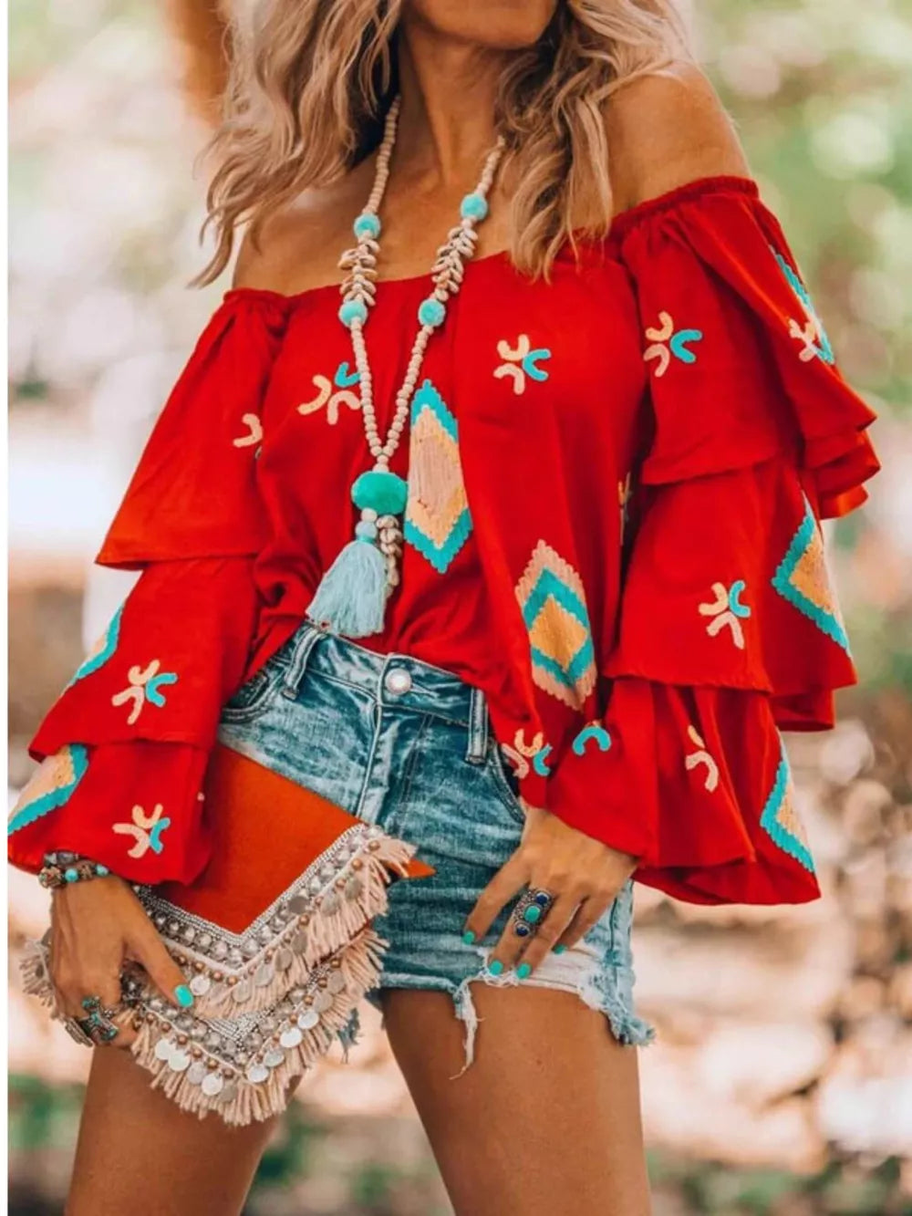 Red embroidered off-shoulder ruffled sleeve shirt with bohemian flair