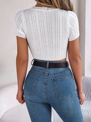 White cable knit crop top with openwork detail and short sleeves.
