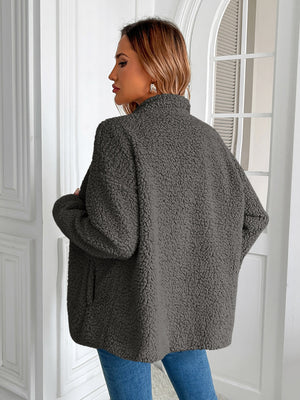 Dark gray teddy fleece jacket with patch pockets and a stand-up collar.