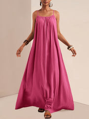 Fuchsia pink maxi swim dress with spaghetti straps and gathered neckline.
