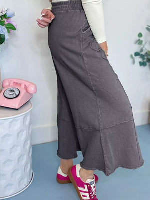 Maternity cropped wide-leg cotton pants in charcoal grey with cargo pockets and a raw hem.