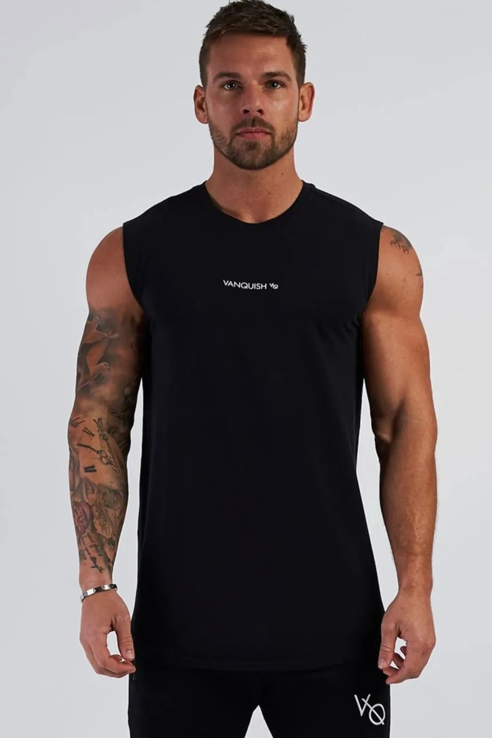 Black performance tank top with white logo detail on chest and sleeve