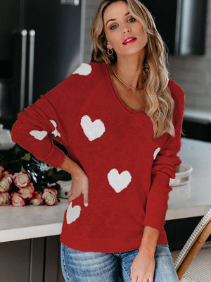 Deep Red heart motif raglan knit sweater with a scoop neck.