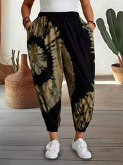 Tie-dye harem trousers with elastic waist and pockets in black and tan.
