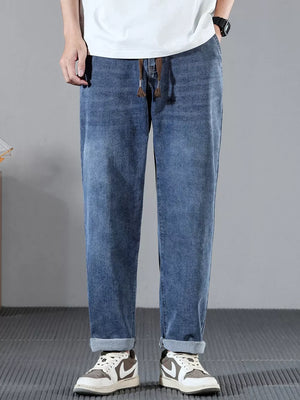 Men's blue cotton wide leg jeans with drawstring waist and cuffed hems