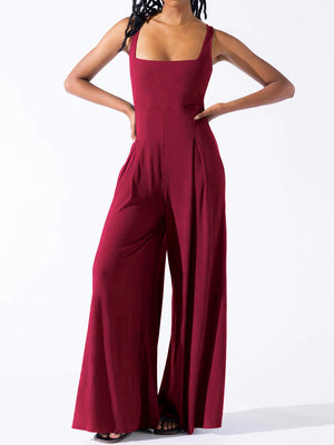 Burgundy square neck palazzo jumpsuit with wide legs and pleat detail.