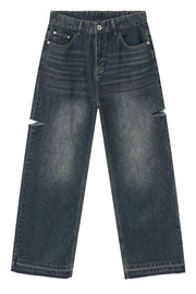 Baggy dark navy denim jeans with distressed knee slits and raw hem.