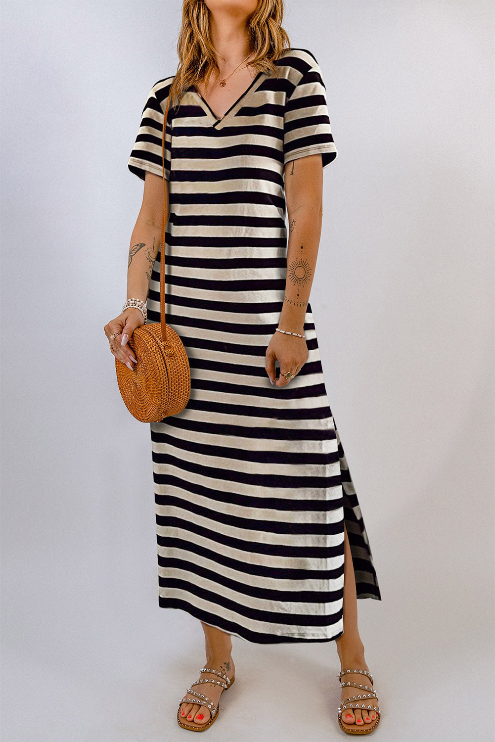 Striped jersey maxi dress with V-neck, short sleeves, and side slit hem.