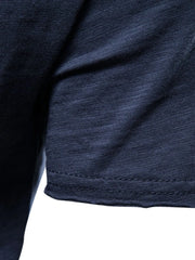 Navy slub cotton crewneck tee showing textured fabric and hem detail.