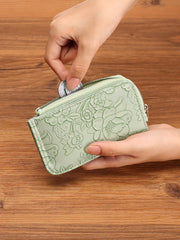 Sage floral embossed mini wallet with zipper closure, coin purse detail.
