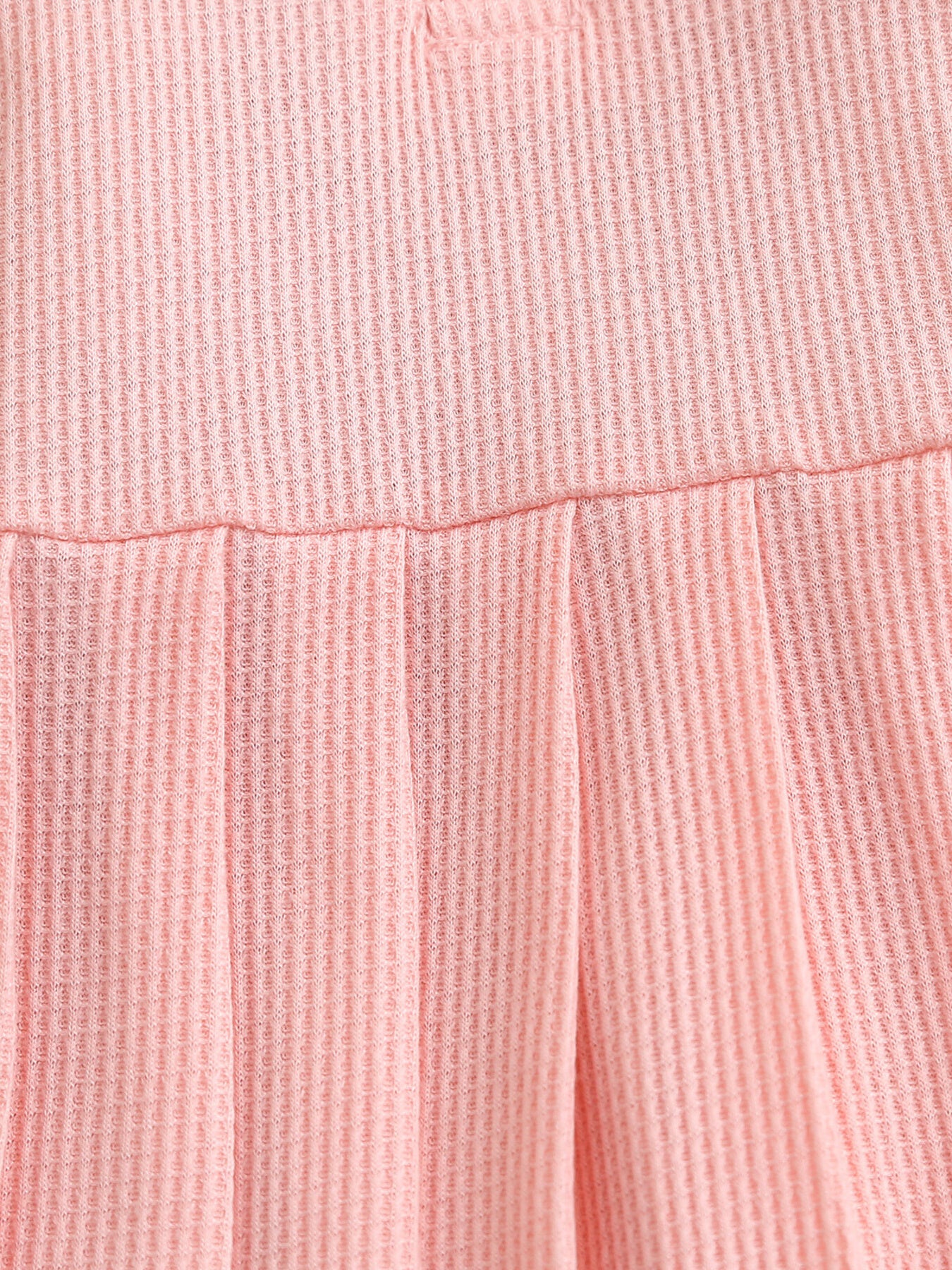 Pink waffle knit baby dress with gathered skirt detail
