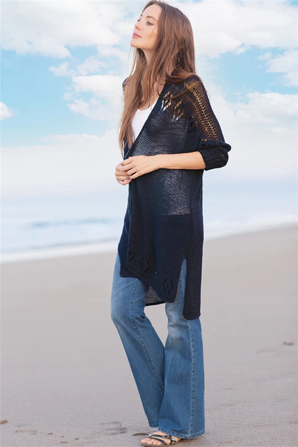 Dark navy open-knit cardigan with slit hem and subtle pattern detail.