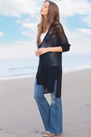 Dark navy open-knit cardigan with slit hem and subtle pattern detail.