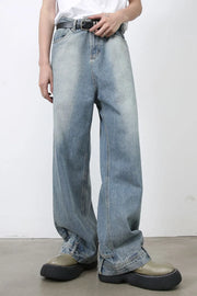 Baggy denim jeans in medium wash with distressed detailing and a relaxed fit.