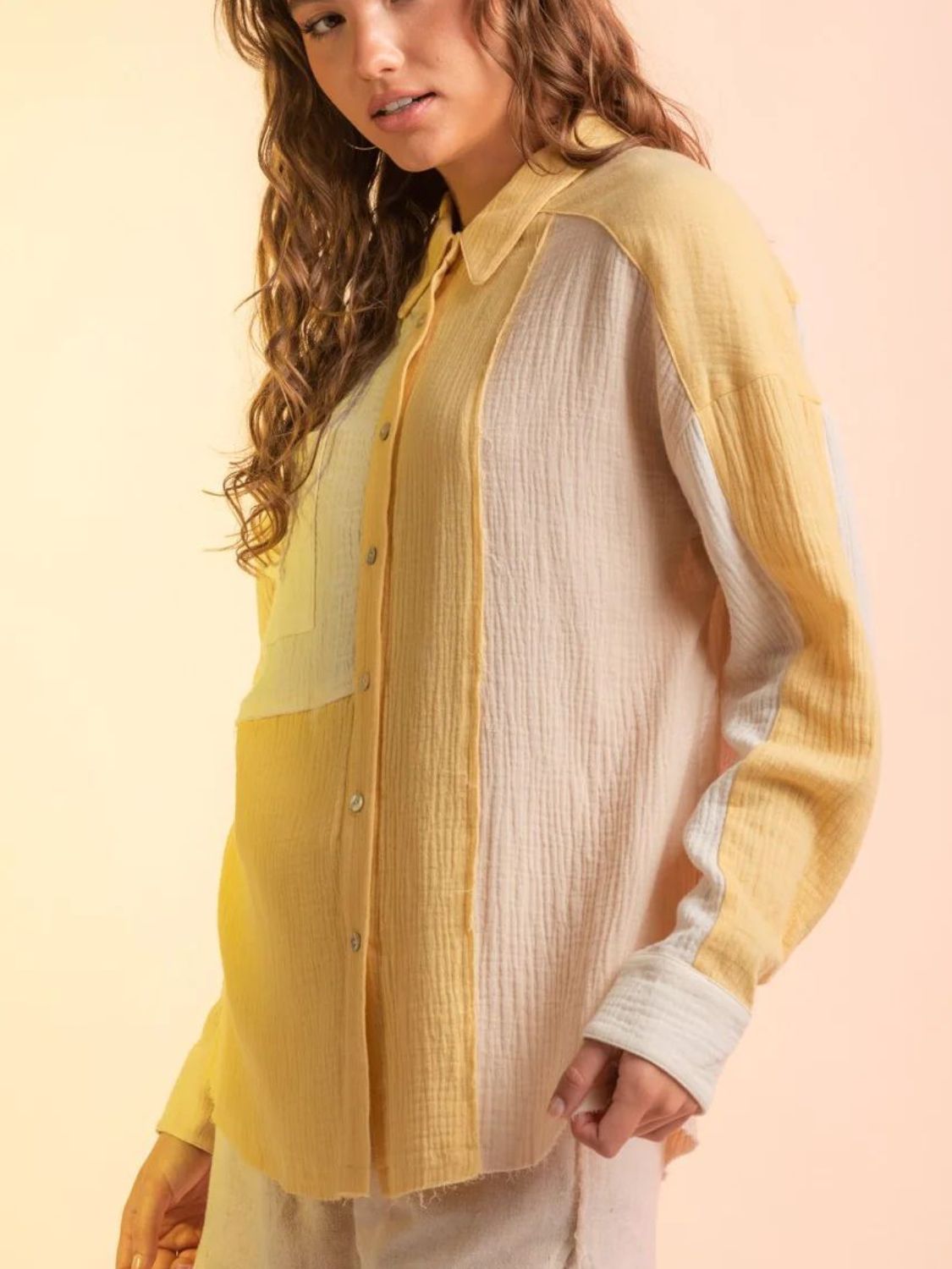 Colorblock gauze shirt jacket in yellow and cream with button front and collared neckline.