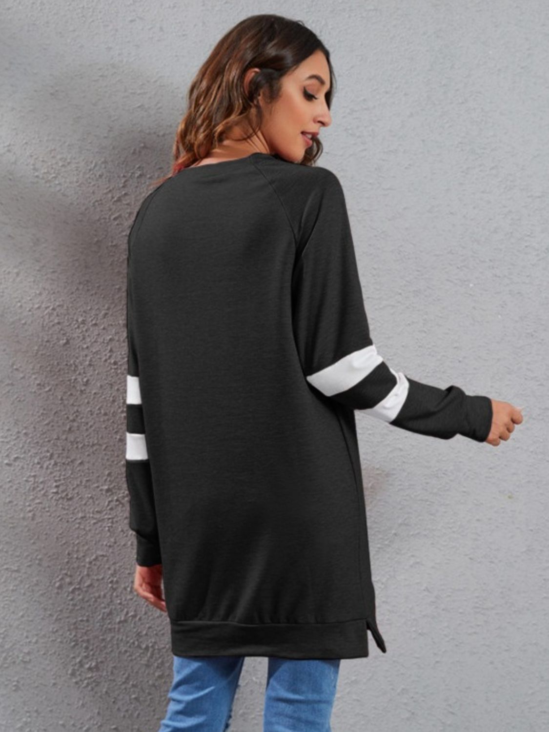 Black sweatshirt dress with white varsity stripes on sleeves, crew neck, long sleeves, polyester