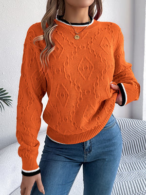 Orange diamond knit sweater with contrast trim neckline and cuffs