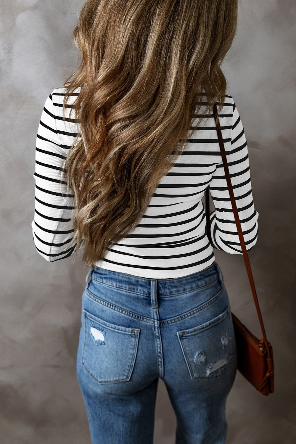 Ribbed stripe long sleeve top in black and white, with a crew neck.