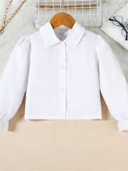 Toddler white collared long sleeve shirt with puff sleeves and ruffled cuffs.