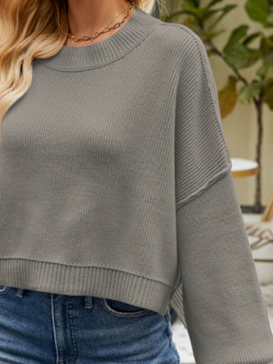 Dropped shoulder knit sweater in Heather Gray with crew neck and ribbed details.