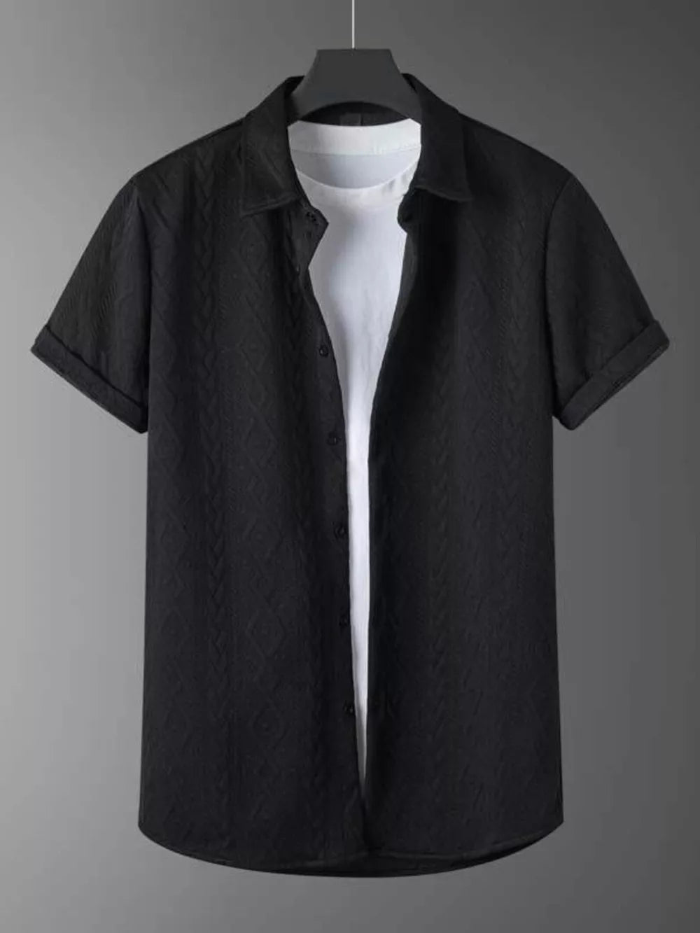 Black textured knit polo shirt with short sleeves and a white t-shirt underneath.