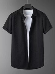 Black textured knit polo shirt with short sleeves and a white t-shirt underneath.