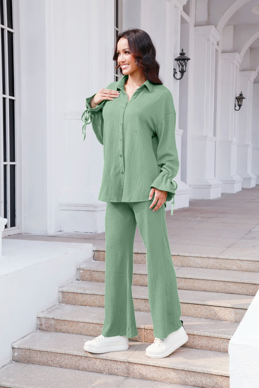 Sage green textured tie-sleeve co-ord set with button-up shirt and wide-leg pants.