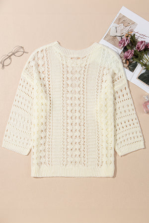 Beige openwork knit beach cover-up with crewneck and 3/4 sleeves.