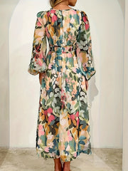 Floral print midi dress with V-neck, long puff sleeves, and belted waist in beige and white.