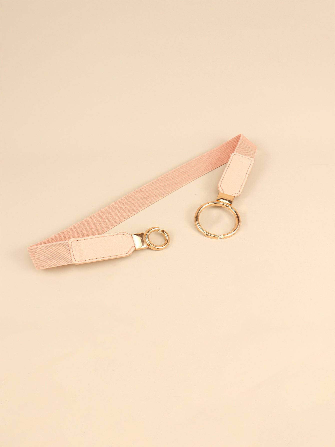 Peach elastic belt with interlocked ring buckle and gold hardware