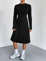 Black ribbed knit fit-and-flare co-ord set with long sleeves and a mock neck.