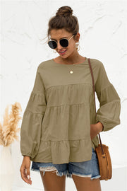 Army green tiered peasant blouse with ruffled balloon sleeves.