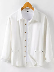 Men's white long sleeve button-up shirt with two chest pockets and wooden buttons.