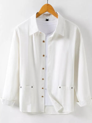 Men's white long sleeve button-up shirt with two chest pockets and wooden buttons.