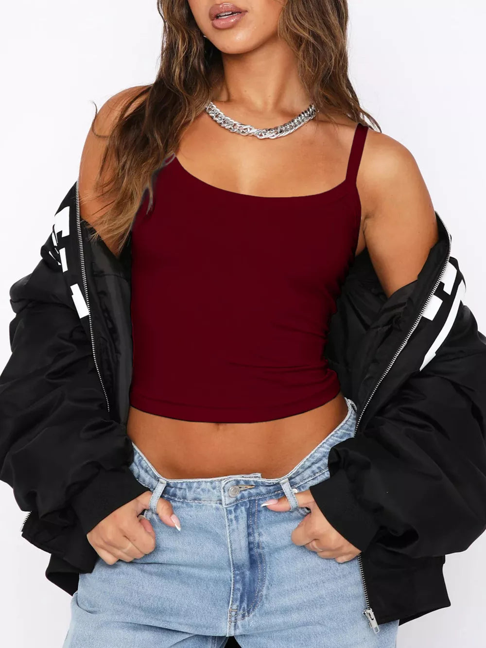 Burgundy ribbed cami with spaghetti straps, cropped length, worn with jeans.
