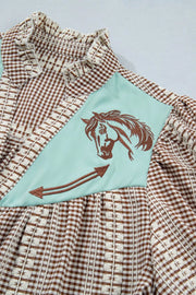 Brown gingham maternity shirt with embroidered horse yoke and puff sleeves.