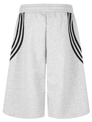 Gray cropped sweatpants with black side stripes and wide legs