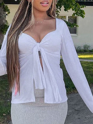White tie-front long sleeve blouse with a square neckline and open front detail.