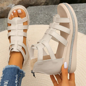 Ivory gladiator wedge sandals with crystal trim and zipper detail.
