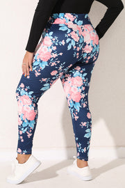 Floral bloom print leggings in peacock blue with pink and light blue flowers.