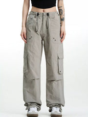 Relaxed fit grey cargo pants with multiple pockets and drawstring waist.