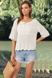 Cream open-knit top with scalloped sleeves and hem, boat neck, and relaxed fit.