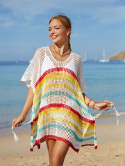 Rainbow stripe crochet beach poncho with V-neck and tassel ties.